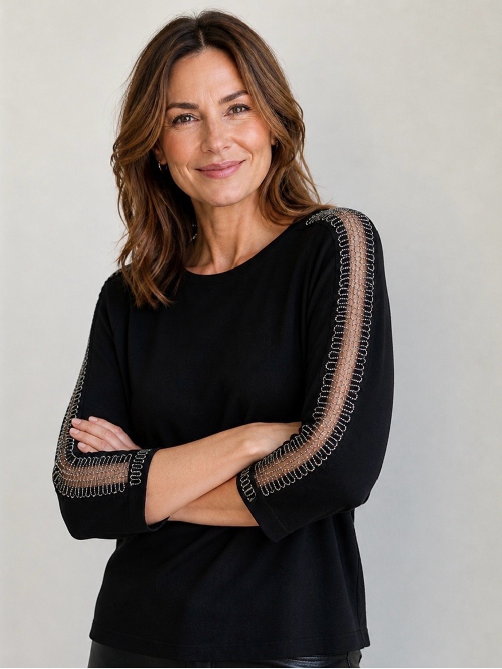 Chic Black knit Top with silver Spiral Sleeve Accent